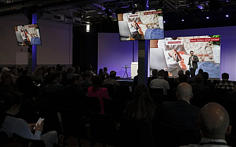 Participants listening to a speaker during a presentation.