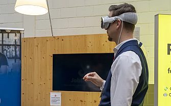 Man wearing VR headset interacting with a digital environment.